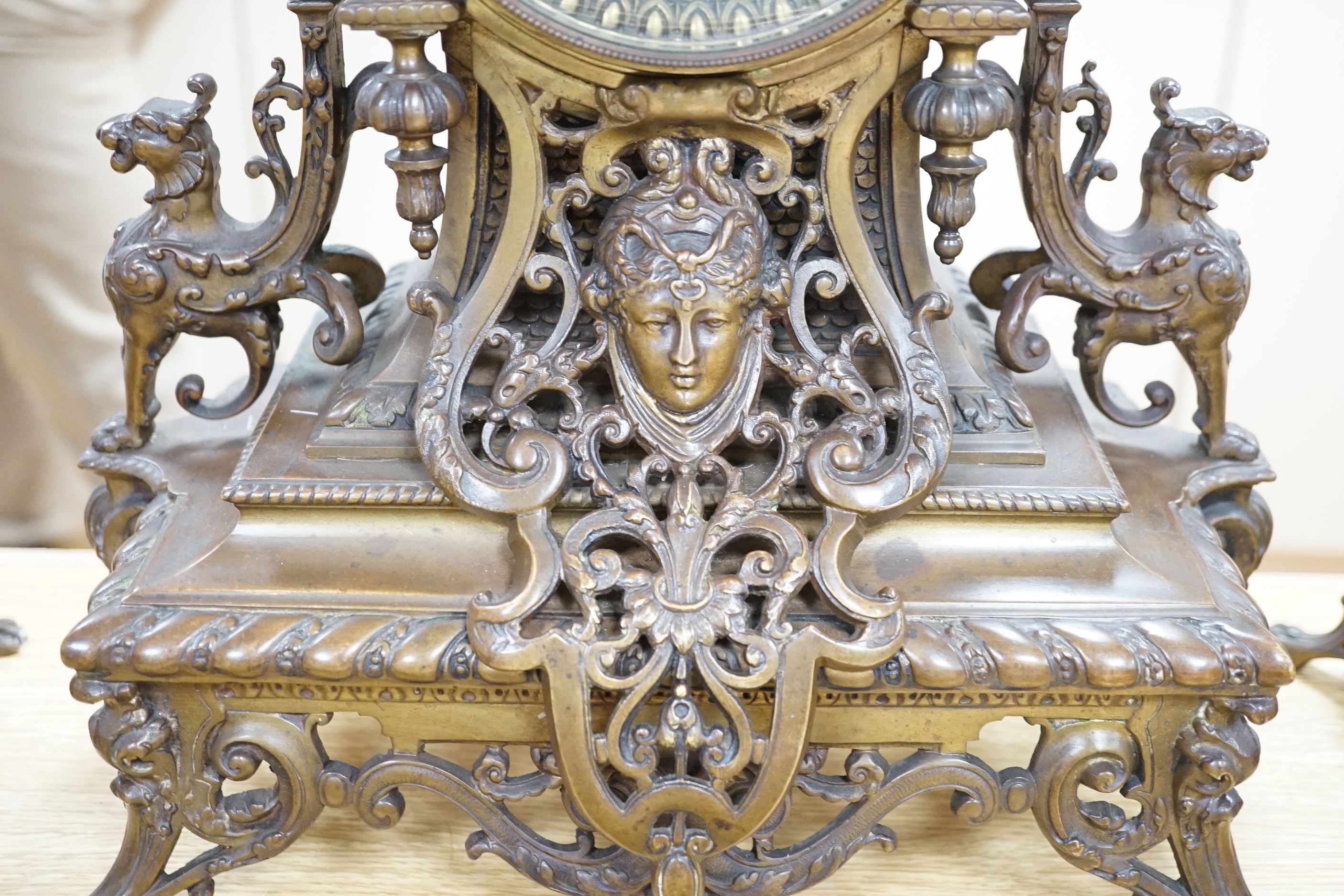 An ornate French bronze clock and five light candelabra garniture, late 19th century, 57cm high